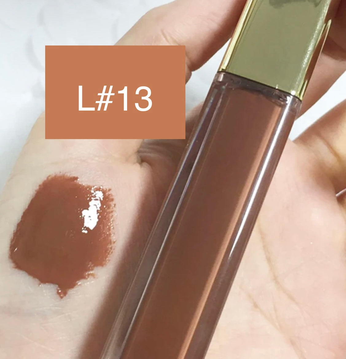 High-Shine Vegan Lip Gloss in variant of L13, providing a vibrant L13 with a glossy shine