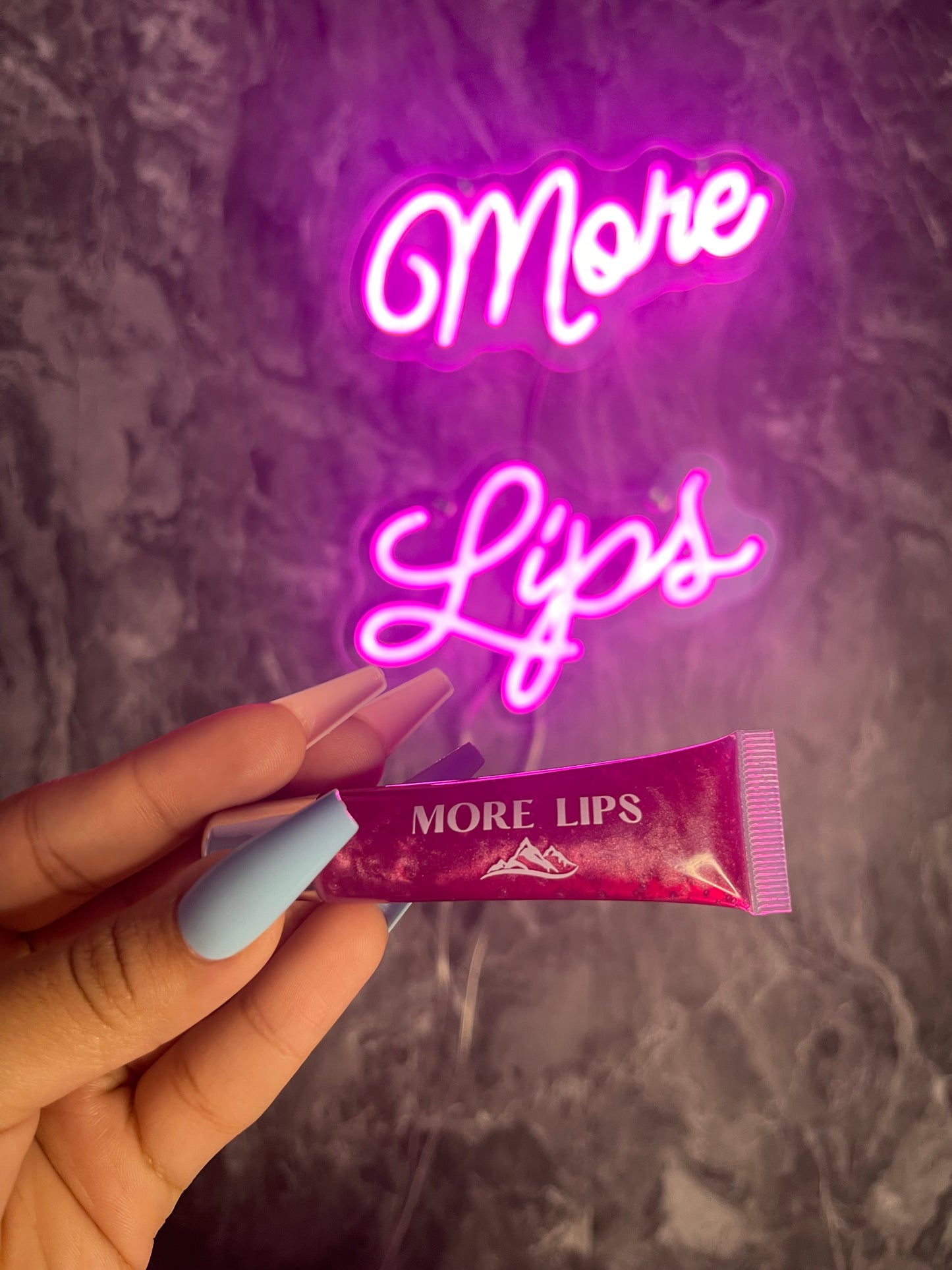 Image of More Lips Vegan Lip Gloss in various shades, showcasing vibrant colors and luscious shine. Cruelty-free and ethical beauty at its best