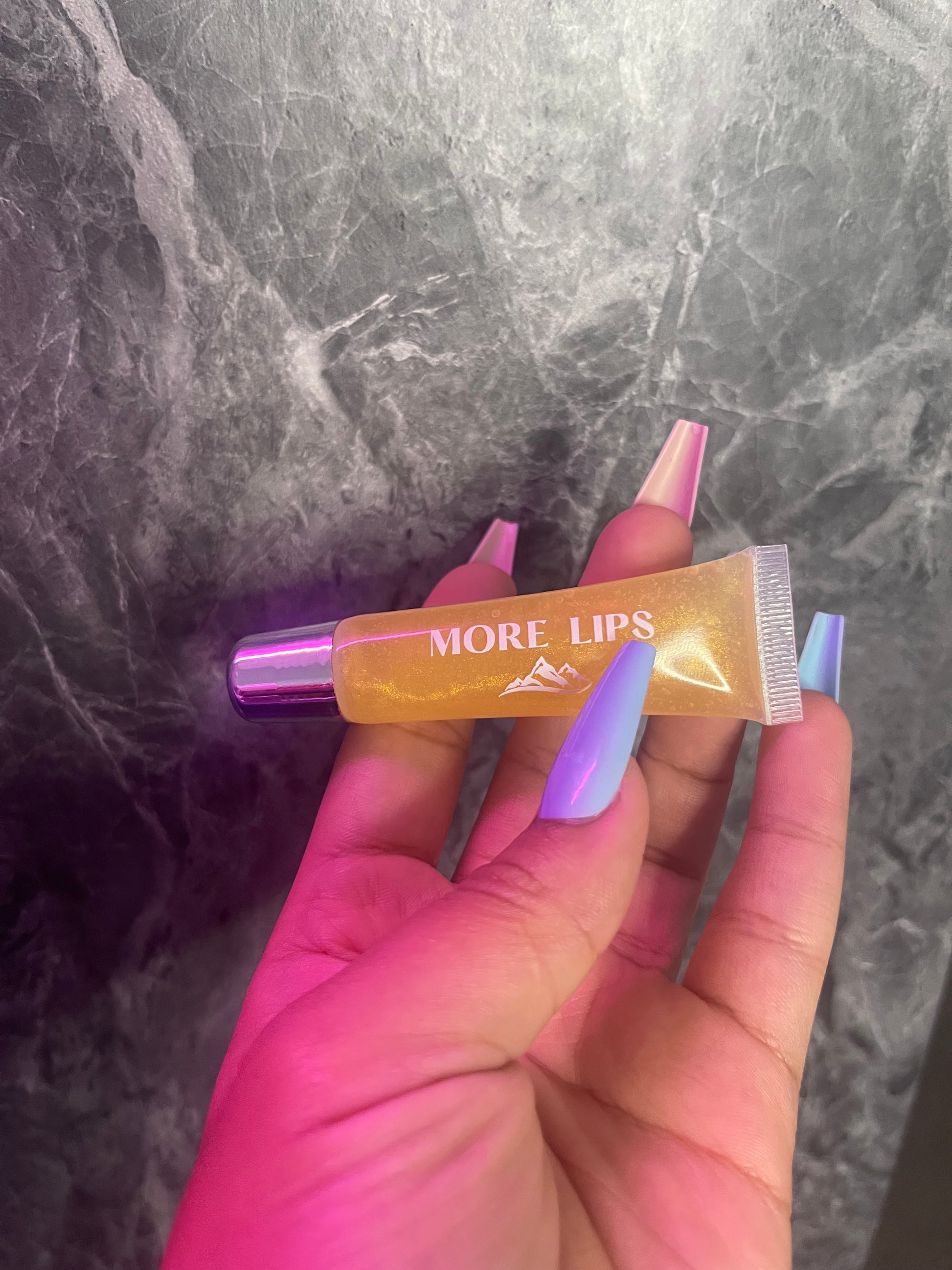 Image of More Lips Vegan Lip Gloss in vibrant shades with luscious shine. Cruelty-free formula for guilt-free glamour. Shop now