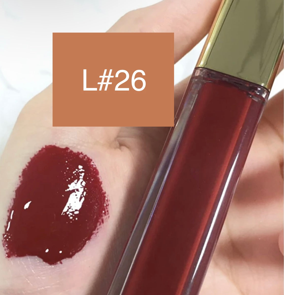 High-Shine Vegan Lip Gloss in variant of L26, providing a vibrant L26 with a glossy shine