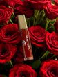 High-Shine Vegan Lip Gloss in Crimson Red, providing a vibrant red color with a glossy shine