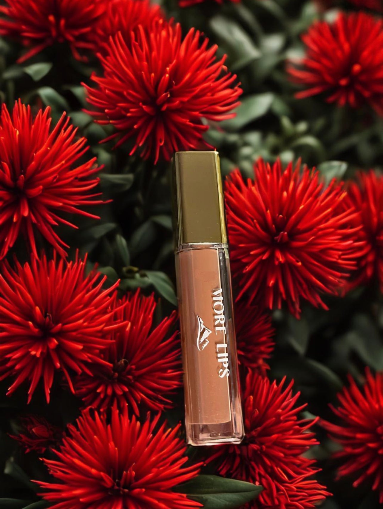 High-Shine Vegan Lip Gloss in Nude Shimmer, featuring a subtle shimmer and a natural nude color for an understated glam.