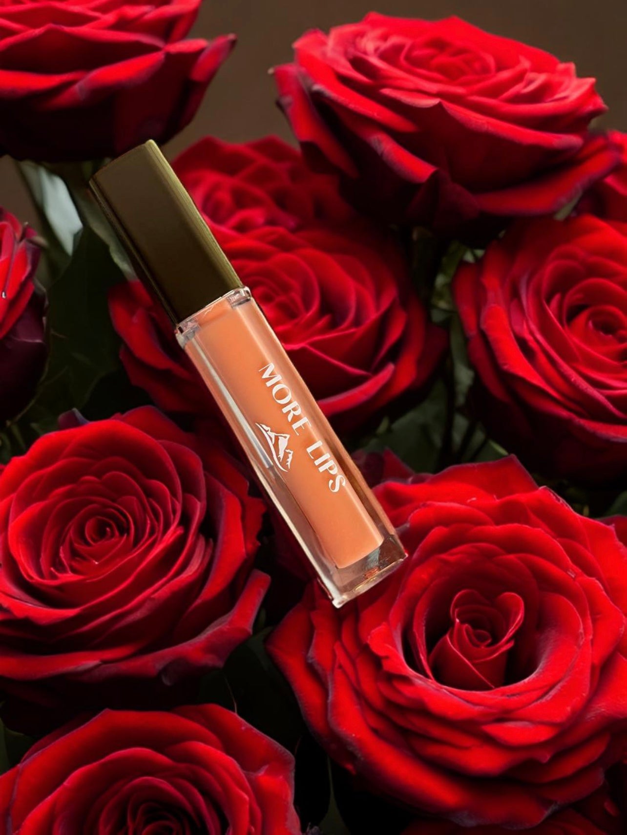 High-Shine Vegan Lip Gloss in Sparkling Coral, a coral shade with added sparkle for a dazzling lip look